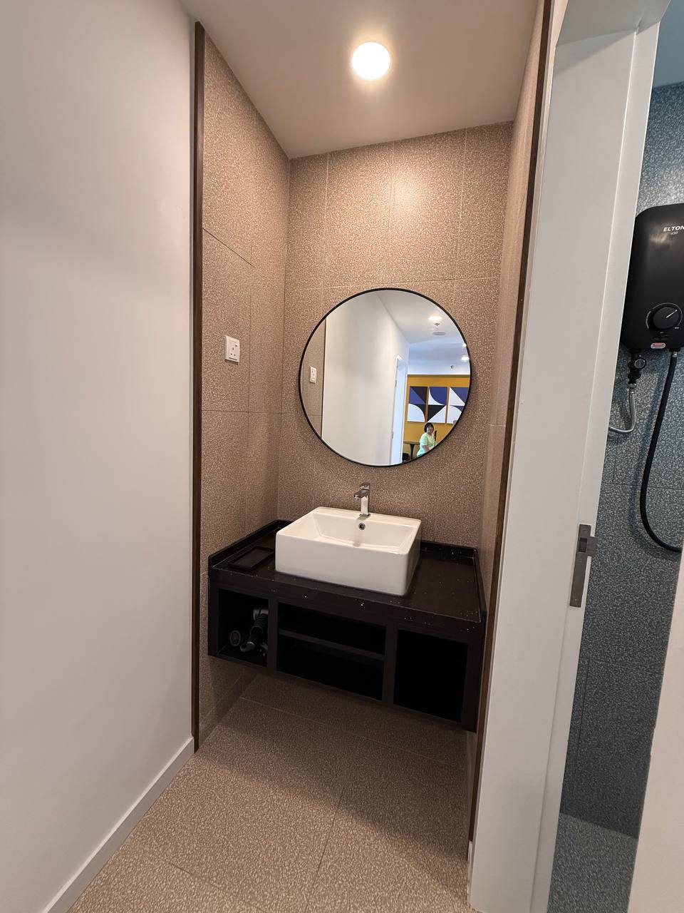 Bathroom vanity with vessel sink and round mirror