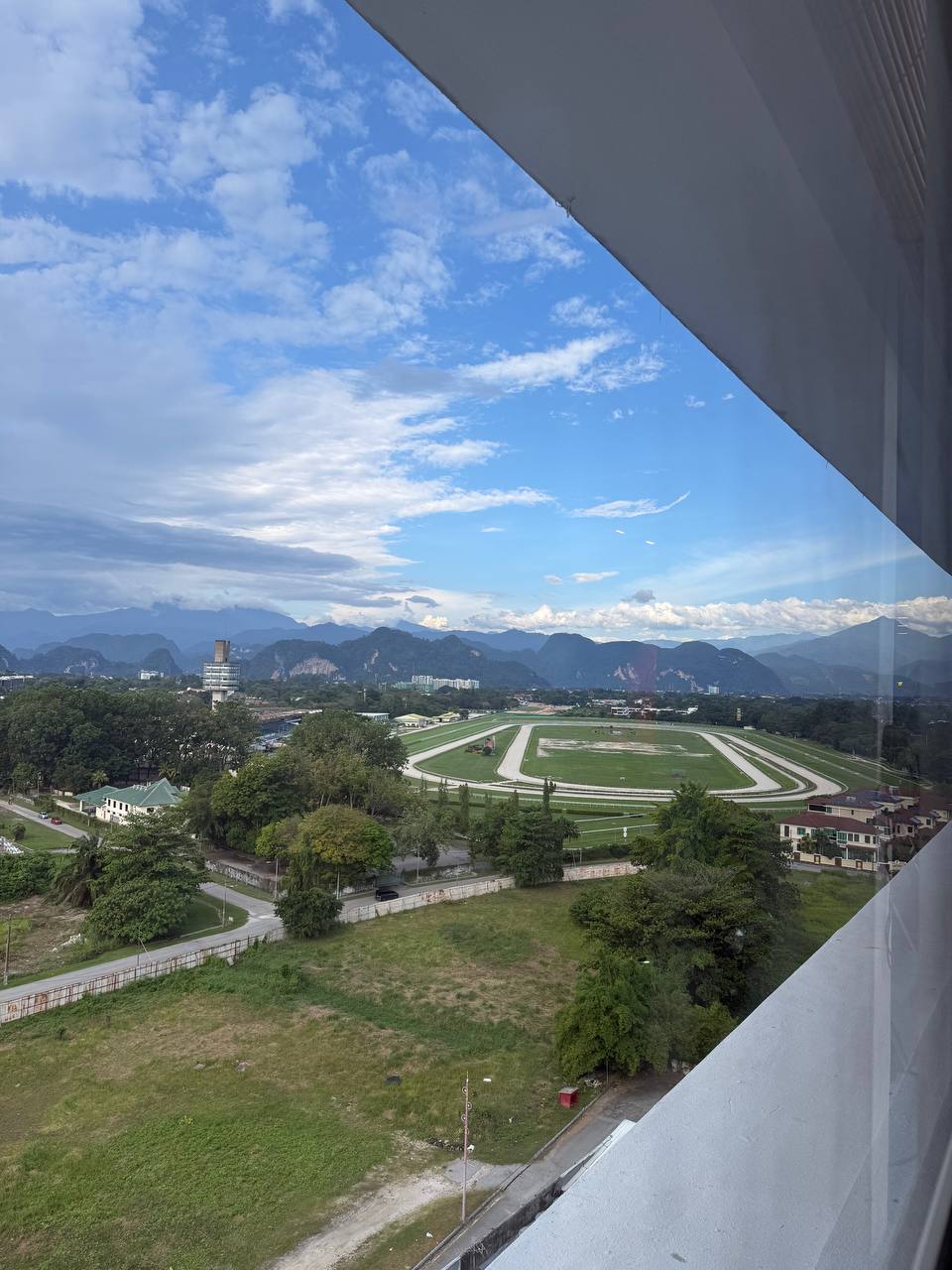 View over the Ipoh Turf Club and mountains from the coworking windows