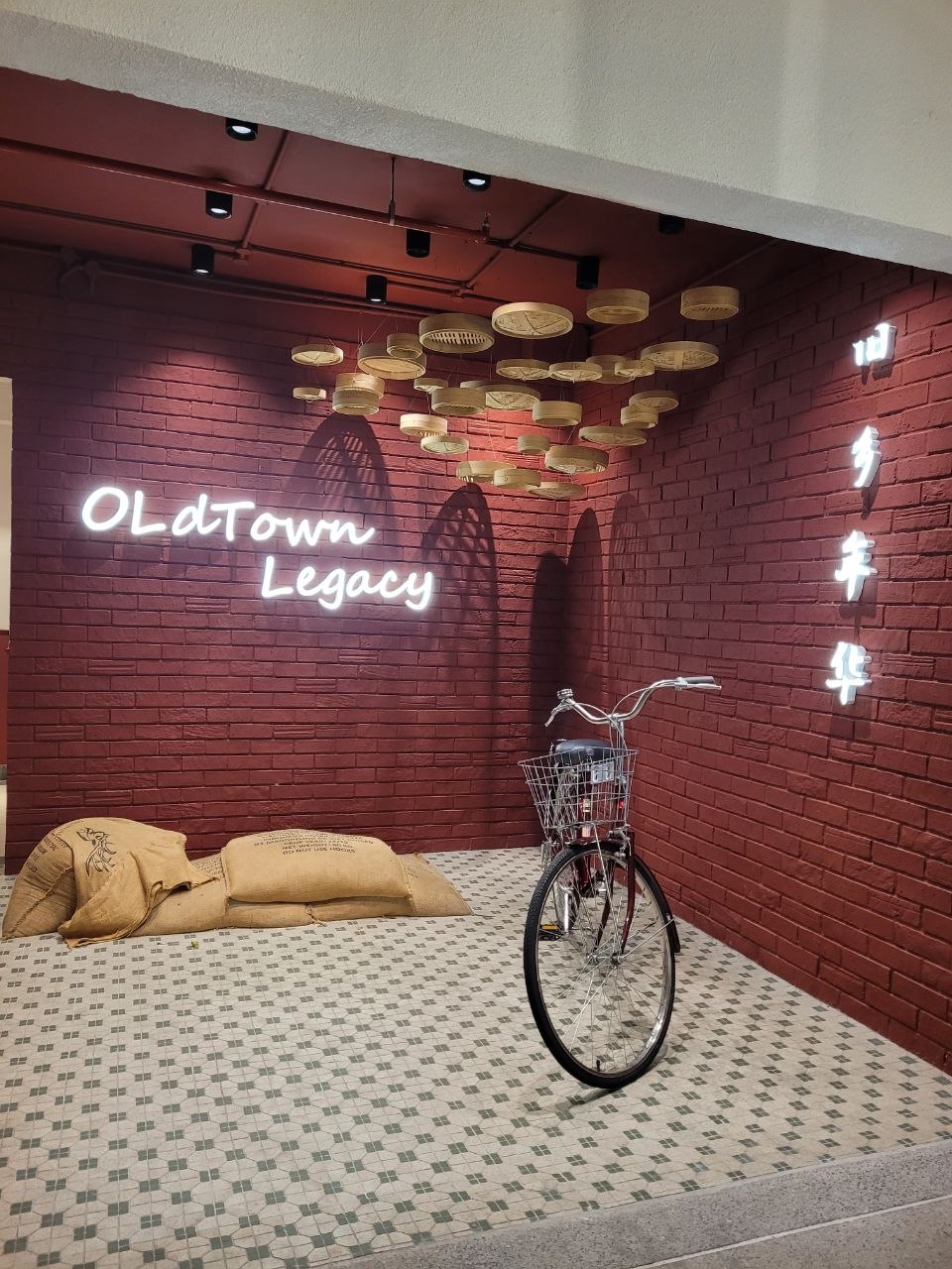 OldTown Legacy heritage corner with bicycle and hanging steamer baskets