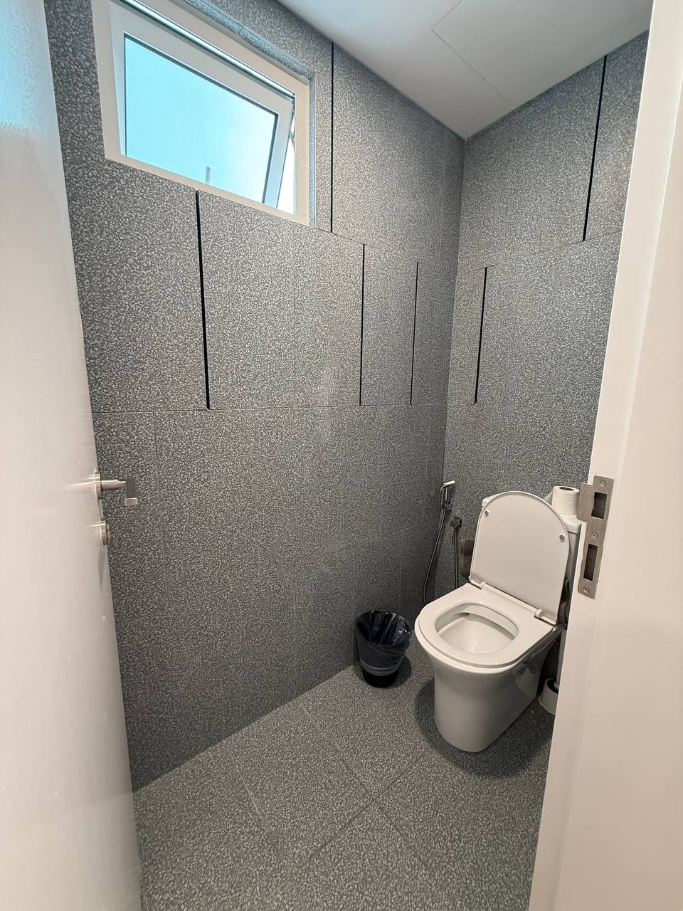 Separate toilet with bidet spray and window